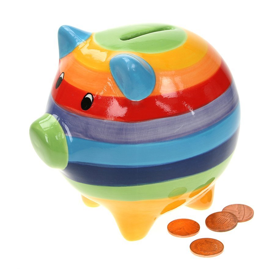 Rainbow coloured piggy bank with four pennies at the side.
